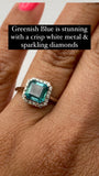 14 karat white gold, 1.5 carat asscher cut emerald and diamond halo ring
