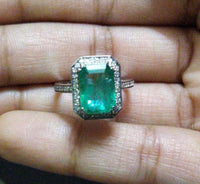 14K Gold Zambian Emerald and diamond halo Ring