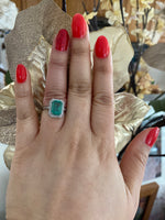 14K Gold Zambian Emerald and diamond halo Ring